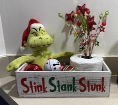 a stuffed animal in a box with christmas decorations