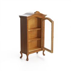 an old fashioned wooden cabinet with mirror on the top and bottom shelf, isolated against a white background