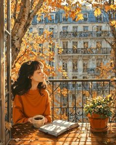 a woman sitting at a table with a book and cup of coffee in front of her