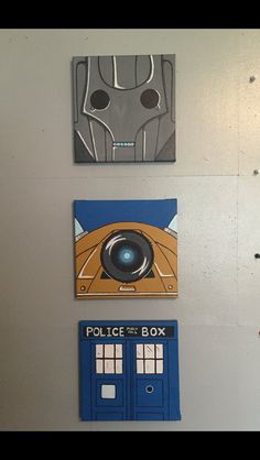 three different pictures on the wall above a blue phone booth and a doctor who door