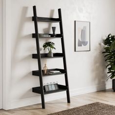 a black leaning shelf with books and plants on it next to a potted plant