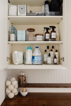 the shelves in this bathroom are filled with cleaning products and personal care items, including toiletries