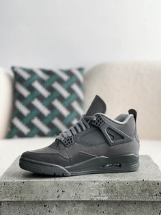 Embrace understated cool with these Air Jordan 4 Retro-inspired "Dark Grey" sneakers. This versatile colorway features a mix of premium grey tones across the upper, creating a sleek and sophisticated look. The iconic silhouette, with signature mesh netting and visible Air unit, delivers classic style and all-day comfort. Whether you're hitting the streets or the court, these sneakers are a must-have for any sneakerhead's collection. Grey Jordan 4, Sporty Gray High-top Air Jordan 4, Luxury Gray Low-top Air Jordan 4, Air Jordan 4 High-top Gray Shoes With Branded Insole, Modern Black Low-top Air Jordan 4, Luxury Fade-resistant Air Jordan 4 For Streetwear, Jordan 4 Retro, Fall Winter Jacket, Jordan Shoes Girls