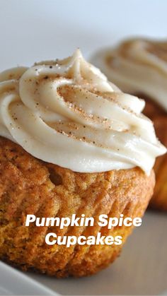 two pumpkin spice cupcakes on a white plate