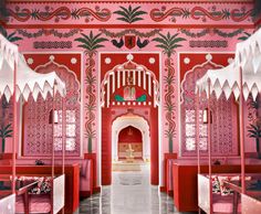 an ornately decorated room with pink walls