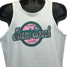 "All Star Cafe Miami Beach Vintage 90s Tank Top T Shirt Florida White Made In USA Graphic Sleeveless Tee Condition: Has image fading. See photos. Size and Measurements: Mens/Unisex Medium Width 20.5\" - Underarm to underarm Length 25.5\" - Measure from top of shoulder at the edge of collar to the bottom of the shirt" 90s Tank Top, Star Cafe, Beach Tanks Tops, Beach Tanks, Beach Vintage, Beach Cafe, Sleeveless Tee, Vintage T Shirts, Top T Shirt