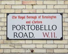 a sign on the side of a building that says, the royal borough of kensington and chelsea