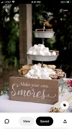 a wooden sign that says make your own s'mores on top of a table