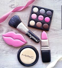 mac cosmetics and lipstick on a wooden table