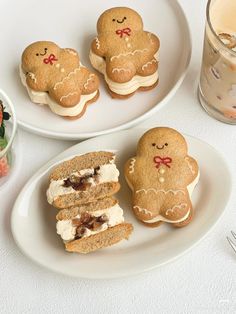 two plates with cookies and sandwiches on them