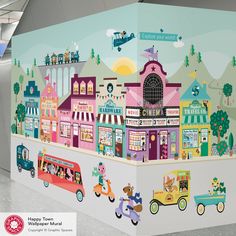 a wall mural in an airport with vehicles and buildings painted on the walls, along with children's toys