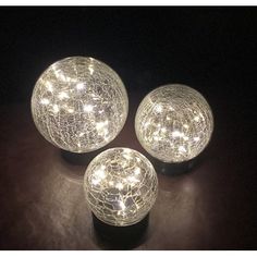 three lights that are on top of a table