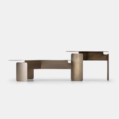 the table is made out of concrete and has two small tables on each side, one with