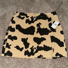 Dry Goods Le Lis Collection High Waisted Cow Print Mini Skirt Size Medium New With Tags. Brand: Le Lis Waist 29 In Length 15.5” In In Perfect Condition! No Stains, Fading, Tears, Or Any Significant Wear Whatsoever. Smoke And Pet Free Home. Contact Me For Any Questions Regarding This Item For Sale. Buyers Who Purchase 2 Or More Items From My Store Will Receive A Special Discount! Happy Shopping :) Print Mini Skirt, Dry Goods, Cow Print, Black And Tan, Mini Skirt, Happy Shopping, Cow, Womens Skirt, Mini Skirts