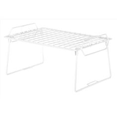 a white metal bed frame sitting on top of a table