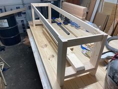 a wooden table being built in a workshop