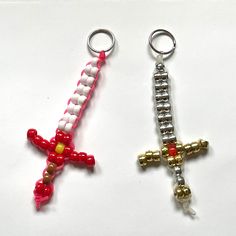 Handmade with pony beads. About 5 X 2.5 inches. Colors and size may vary slightly. Each sword comes with a metal ring or clip. Keychains are perfect for backpacks, purses, tote bags, pin boards, wall decor, and more. Pony Bead Cross Keychain, Minecraft Pony Bead Patterns, Keychain Ideas Diy Crafts, Things To Make Out Of Pony Beads, Seed Bead Animals Patterns Easy, Diy Pony Bead Crafts, Pony Beads Animals, Pony Bead Projects Key Chains, Matching Perler Bead Keychains