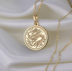 🐉 Step into the enchanting realm of Chinese New Year with our mesmerizing dragon necklace! 🎉 Crafted with meticulous attention to detail, this exquisite piece is a vibrant celebration of tradition, strength, and auspicious beginnings. Imagine the majestic dragon, intricately designed with shimmering scales ✨ and fierce claws, symbolizing power and resilience. With each wear, you'll embody the spirit of this mythical creature, carrying with you the energy of the Lunar New Year. 🌟 * Gender : Male / Female * Material Options : Silver, Gold Plated, Rose Gold, 14K Solid Gold * Thickness of Silver Pendant: 1.0 mm * Thickness of Gold Pendant: 0.8 mm * The Gold Plated and The Rose Gold Plated options are applied to 925 Sterling Silver with solution that contains 14K Gold. * There are several op Majestic Dragon, Mythical Dragons, Dragon Necklace, Mythical Creature, Crafts Jewelry, Dragon Pendant, Chinese Traditional, Lunar New Year, Diy Crafts Jewelry