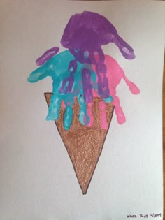 an ice cream cone with purple and blue paint on it