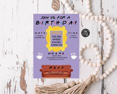 a birthday card with a couch and tassels on the table next to it