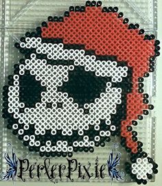 this is a beaded picture of a skull in the shape of a pirate's hat