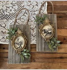 two wooden plaques with leaves on them sitting next to a lace doily wall hanging