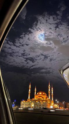 the view from inside a car looking at a mosque