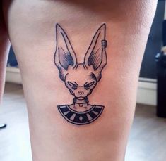 a tattoo on the leg of a person with an image of a rabbit in it's head