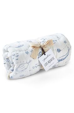 the blue and white baby swaddle has a bow on it