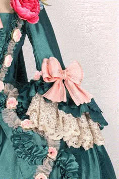 Revel in the grandeur of the past with our Emerald Baroque Style Gown, a resplendent tribute to the rococo and baroque eras. This majestic Victorian Ball Dress, reminiscent of Marie Antoinette's opulent wardrobe, is a symphony of lush emerald green and delicate blush accents. Adorned with artful floral appliqués and ornate lace, each detail is meticulously crafted to evoke the romance of an enchanted garden. The luxurious bows and ruffles are strategically placed to celebrate and flatter a plus- Victorian Ball Dress, Gunne Sax Wedding Dress, Victorian Style Wedding Dress, Historical Outfits, Georgian Dress, Antique Wedding Dresses, Victorian Ball, Victorian Style Wedding, Rococo Dress