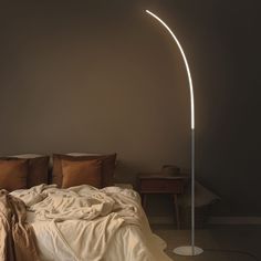 The barely there silhouette of our Curva floor lamp is a study in Minimalism, with a chrome finish that blends into any modern space; This sleek 64-in tall floor lamp has a touch-sensor switch; connect it to our Jonathan Y Smart Home plug and app for instant voice control; Brighten your interiors with bright, warm LED light that's perfect for reading, work and play; add an LED-compatible dimmer switch for soft, ambient lighting; Safe, energy efficent integrated LED bulbs stay cool to the touch a Lamp Bedroom Ideas, Minimal Floor Lamp, Curved Floor Lamp, Metal Minimalist, Tall Floor Lamp, Contemporary Lighting Design, Tall Floor Lamps, Floor Lamp Bedroom, Minimal Lighting