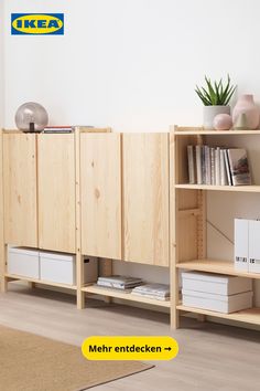 a book shelf with some books on it and a plant in the corner next to it