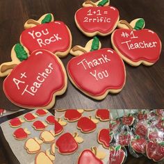 some cookies that are on top of a table with thank you written on them and an apple cookie