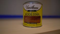 a can of wood stain sitting on top of a table