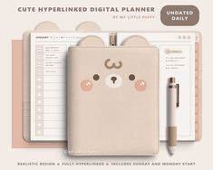 a planner with a bear face on it and a pen in front of the cover