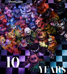 a bunch of stuffed animals that are on a checkered floor with the words 10 years in front of them