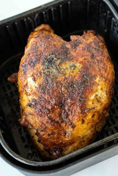 a close up of a cooked chicken in a pan