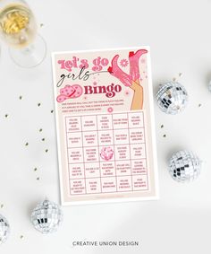 a pink and white party game with disco balls