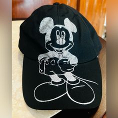 Mickey Mouse Disney Resort Cap. With Silver Mickey In The Front. Inner Bill Is Also Silver. New With Tags. Velcro For Size Adjustment In The Back, With “Disneyland Resort” Embroidered On It. Black Mickey Mouse Cap, Casual Black Mickey Mouse Hat, Disneyland Hats, Mickey Mouse Disneyland, Mickey Mouse Hat, Mickey Mouse Ears Headband, Disney Minnie Mouse Ears, Minnie Ears Headband, Disney Mickey Ears