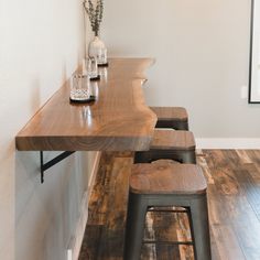 two stools and a table in a room