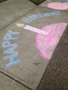 the sidewalk has chalk writing on it that says happy birthday and an ice cream cone