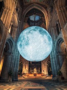 an image of the inside of a church with a giant moon on it's ceiling