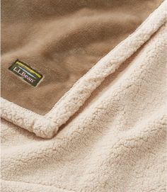 a close up of a blanket with a label on it