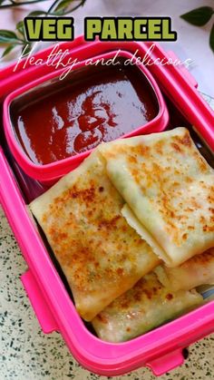 some food is in a pink container on a table