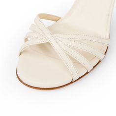 Nadine in milk is a showstopper worthy of your attention. Designed and made in Italy, this classic style has multi-band strap across the toes and a slim sandal back. The front straps design can accommodate wider feet, or bunions if needed. The shoe is finished with a subtle signature brilliant adornment on the left heel. With a soft gel padding, you are comfortable from the very first wear. Leather construction with leather lining & sole Wraparound fastening, can be worn around ankle or under in Classic Single Toe Strap Kitten Heels For Summer, Tango Shoes, Dance Movement, Street Shoes, Soft Gel, Florence Italy, Toe Designs, Outdoor Wear, Tango