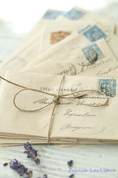 old envelopes tied with string on wooden table