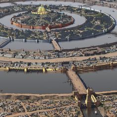 an aerial view of a city with lots of water