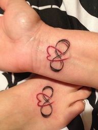 two matching tattoos on the feet of someone's left and right foot are shown