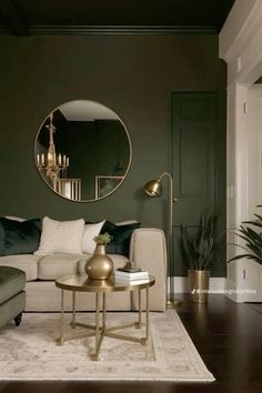 a living room filled with furniture and a large round mirror on the wall above it