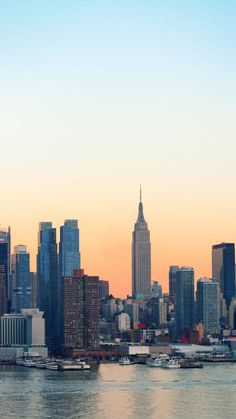 the skyline of new york city at sunset